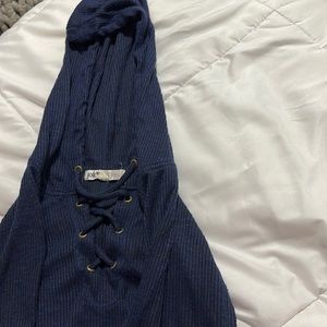 Blue light hoodie mesh stripes on both sleeves and a lace up in the front.